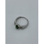 9ct white gold ring with centre green stone and diamonds to shoulder, weight 2.5gm, size O. Estimate