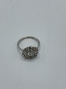 White metal filigree diamond ring, weight 2.7gm, size M. Estimate £400-450.