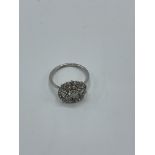 White metal filigree diamond ring, weight 2.7gm, size M. Estimate £400-450.