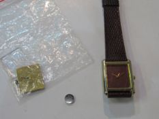 Omega DeVille watch movement together with lady's watch with leather strap. Estimate £20-40.