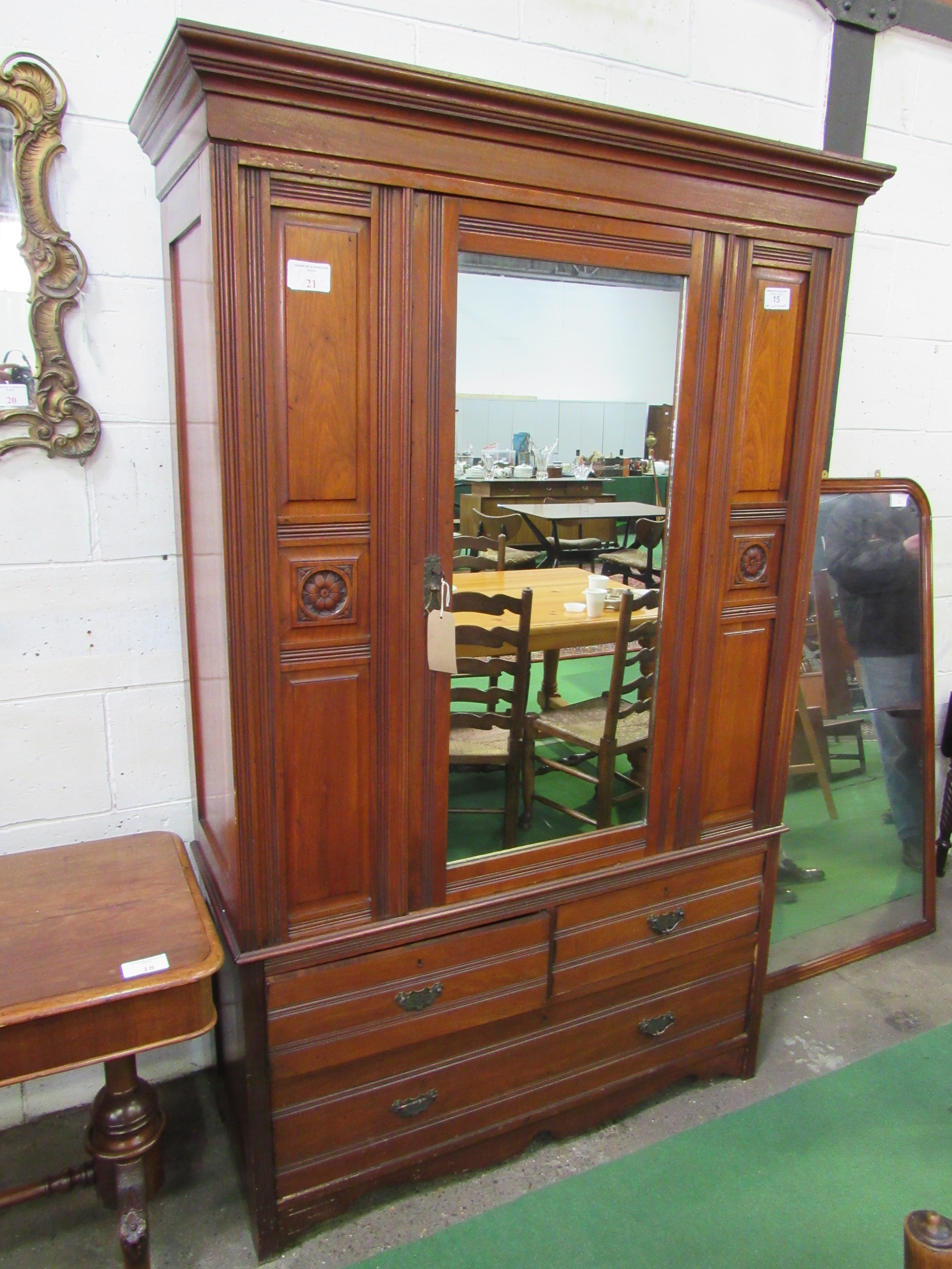 Edwardian mahogany wardrobe with mirror door above 2 over 1 drawers. 132 x 51 x 207cms. Estimate £