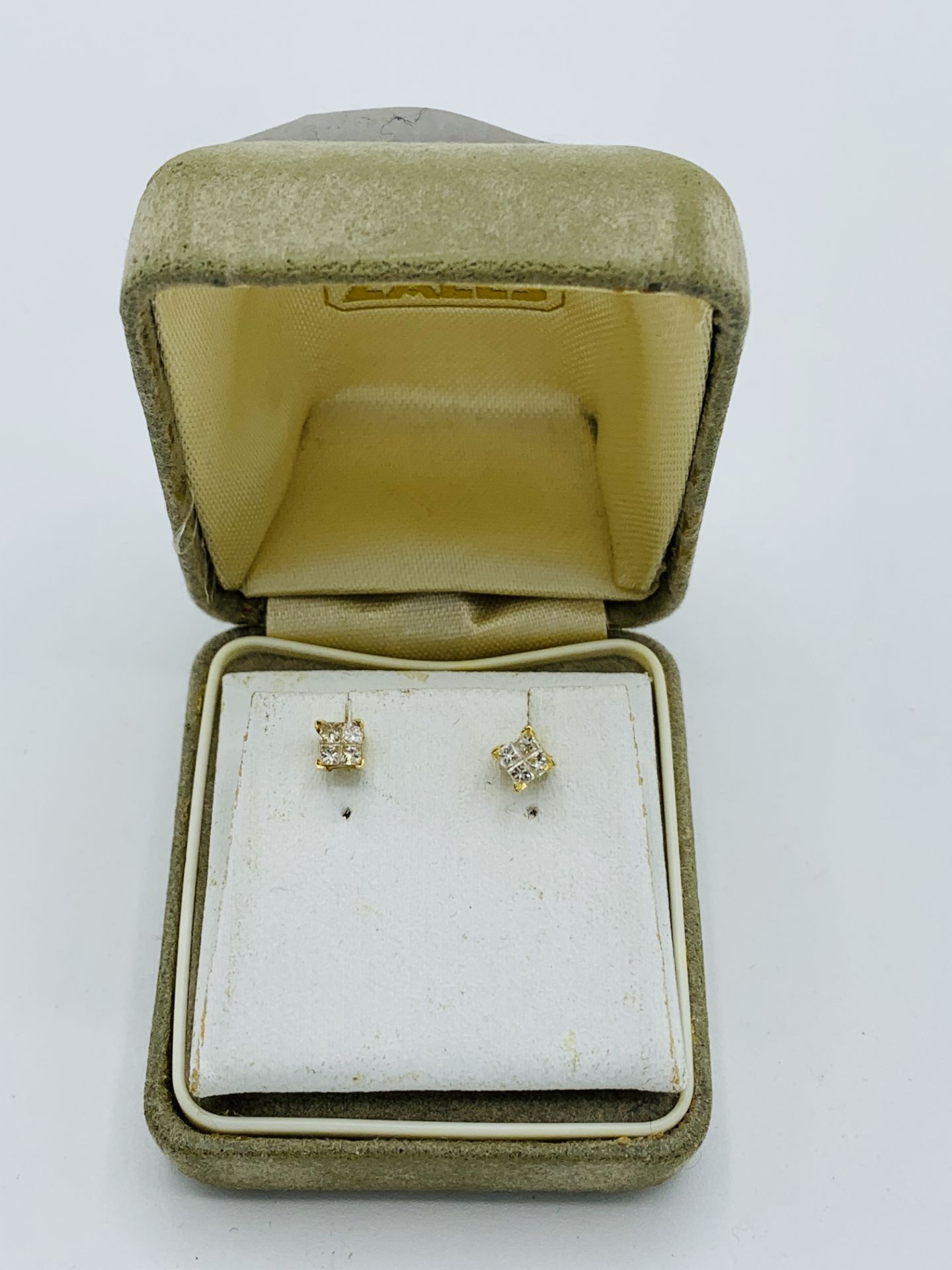 9ct gold and diamond stud earrings, diamonds approx 1/4ct. Estimate £40-50.