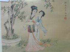 A pair of framed and glazed Japanese paintings on silk of female figures; framed and glazed