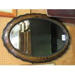 Oval shaped bevelled edge mirror in tortoise shell effect frame. Estimate £20-30