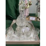 Small silver-plated tray marked JB&S, diameter 20cms together with 6 liqueur glasses and a decanter.