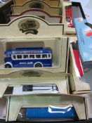 3 boxed vintage model cars; 12 Days Gone buses (all boxed).