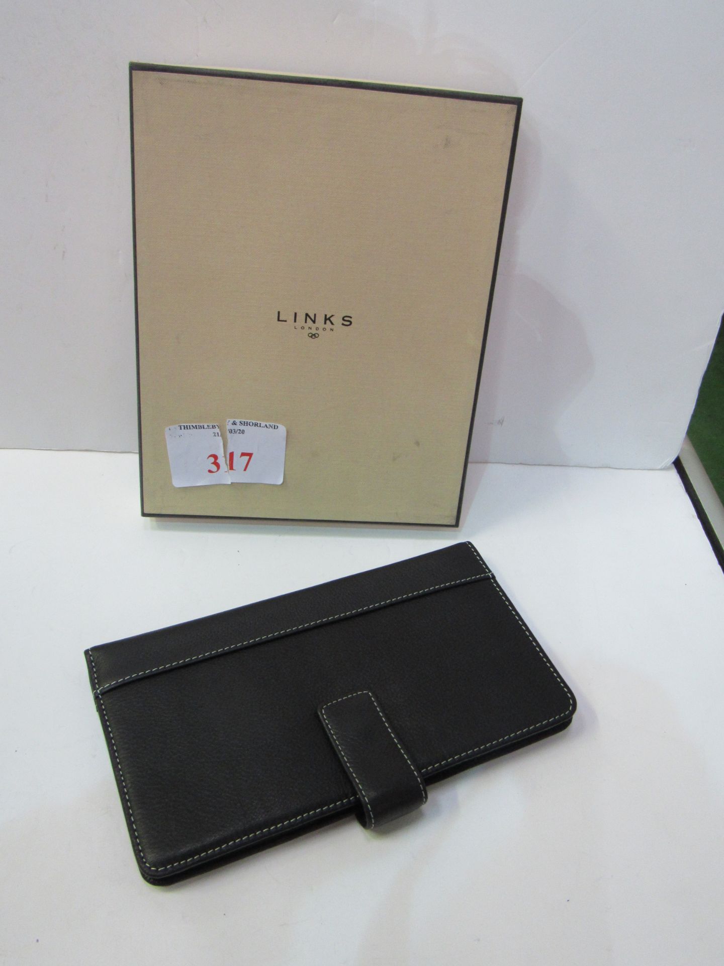 Links of London leather wallet/card holder, dust bag, original box with ribbon. Estimate £30-50.