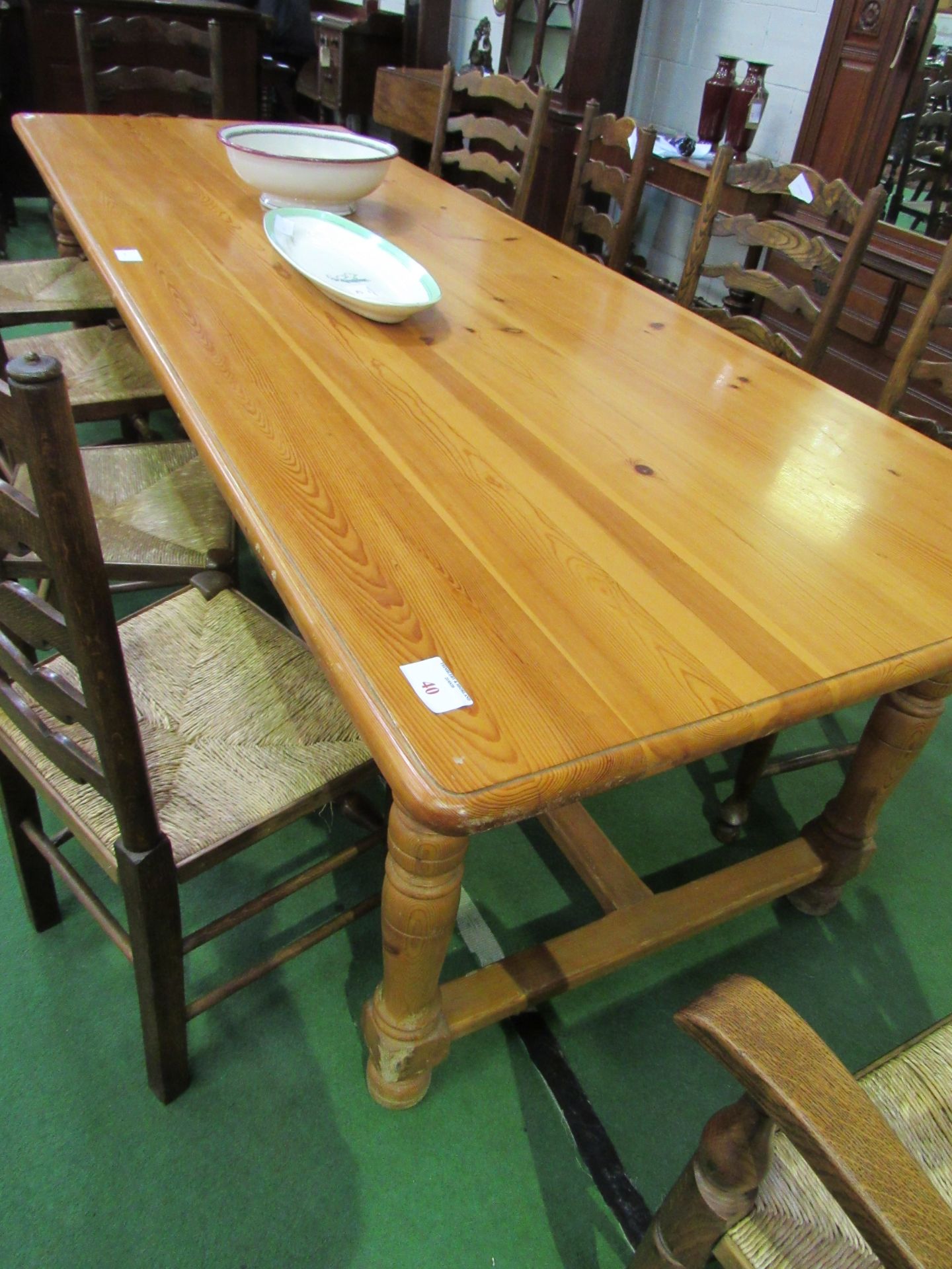 Long pine table on stretcher and block supports, 278 x 100 x 79cms. Estimate £50-80.