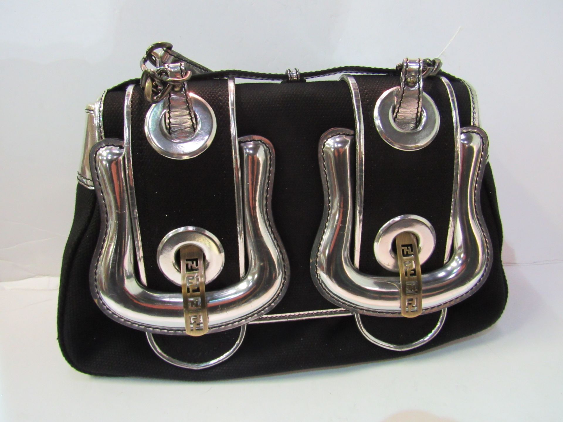 Authentic ""FENDI"" silver trimmed black handbag in dustbag. Estimate £40-60.