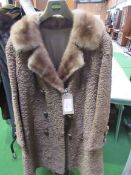 Astriakhan beige coat.