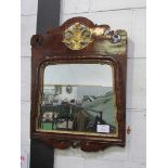 A Georgian mahogany Sheraton wall mirror. Mahogany veneer with parcel gilt waterfall relief