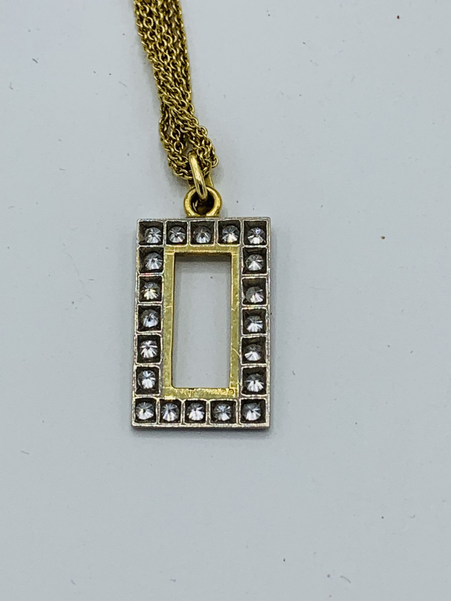 18ct gold and diamond square pendant on a 4 strand 18ct gold chain, chain length 42cms. Estimate £ - Image 3 of 3