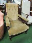 Victorian / Edwardian brown upholstered armchair on casters. Estimate £20-40.