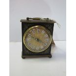 Miniature mantel clock with alarm by Silvoz, Germany. Estimate £20-40.