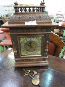 Oak cased mantel clock by W&H Son. Estimate £40-60.