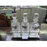 Silver plated Tantalus by J.B & S together with 3 cut glass decanters. Estimate £30-50.