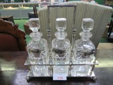 Silver plated Tantalus by J.B & S together with 3 cut glass decanters. Estimate £30-50.