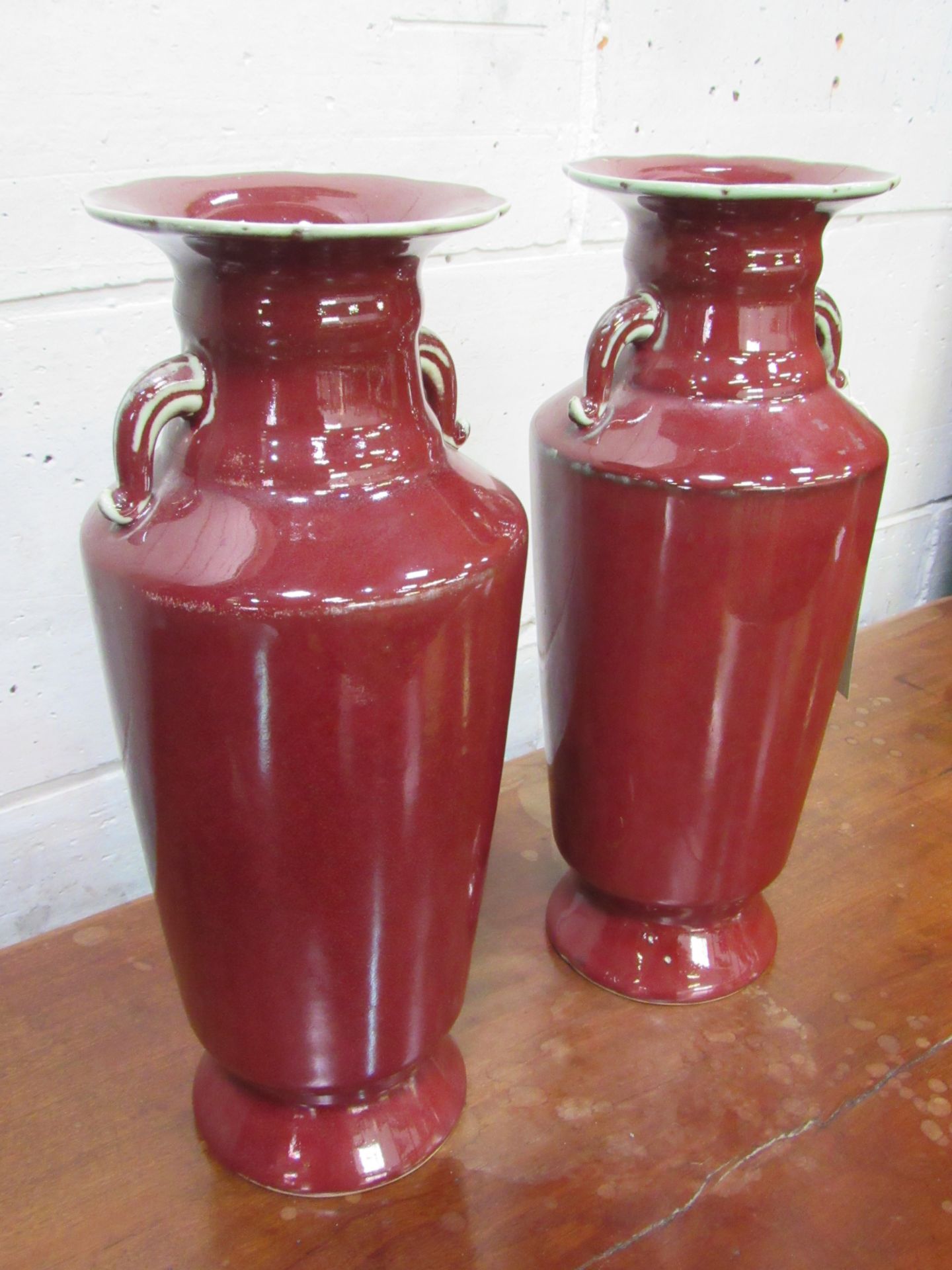 A pair of Sang de Boeuf vases. Height 35cms. Estimate £50-80. - Image 3 of 3