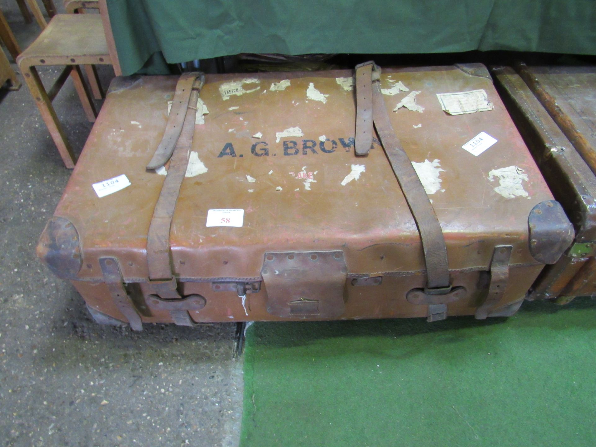 Leather small trunk/suitcase with straps, 95 x 58 x 33. Estimate £10-20.