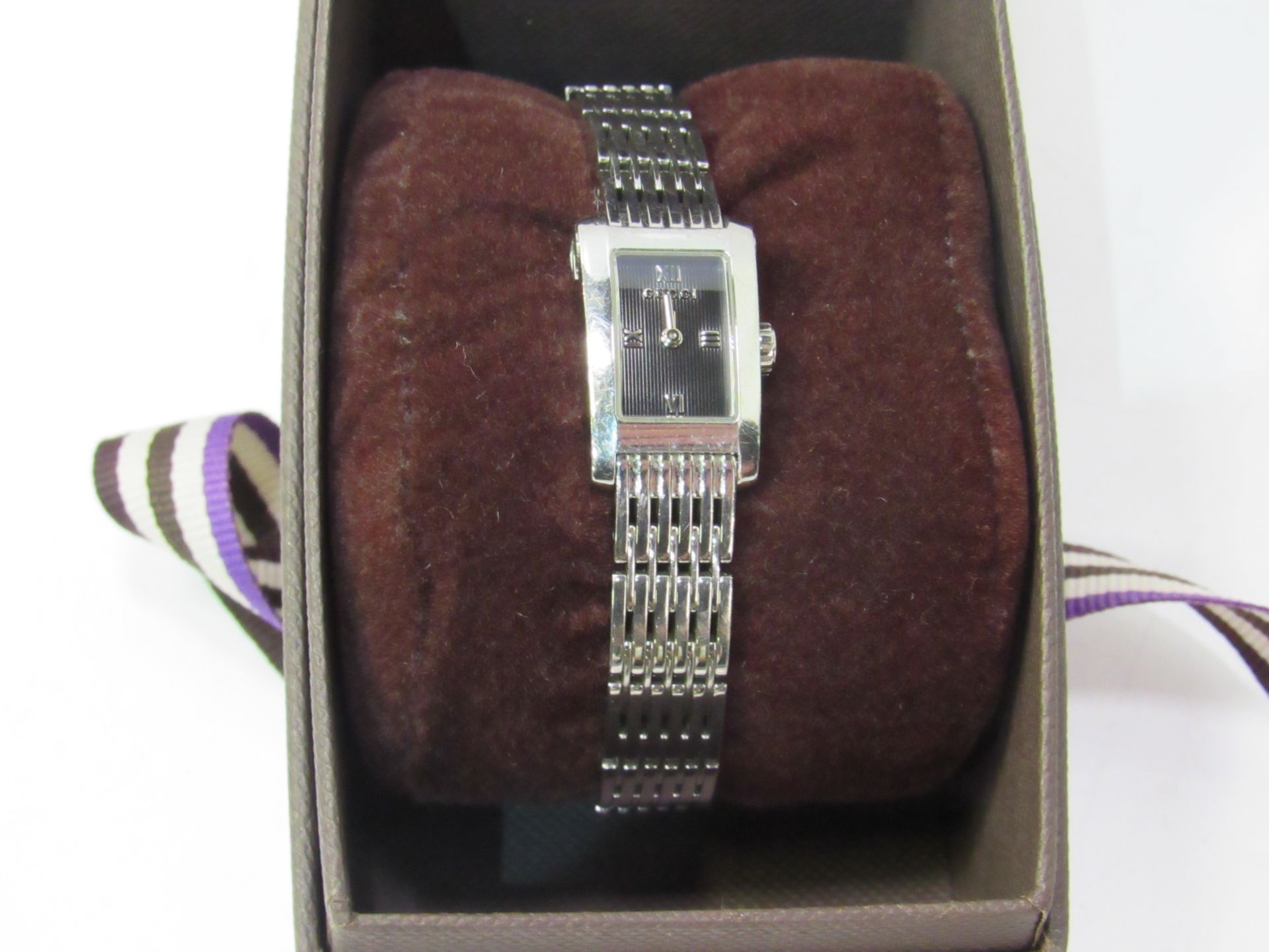 Gucci Lady's Dress Watch, having code number, in jeweller's display box. Estimate £30-50.