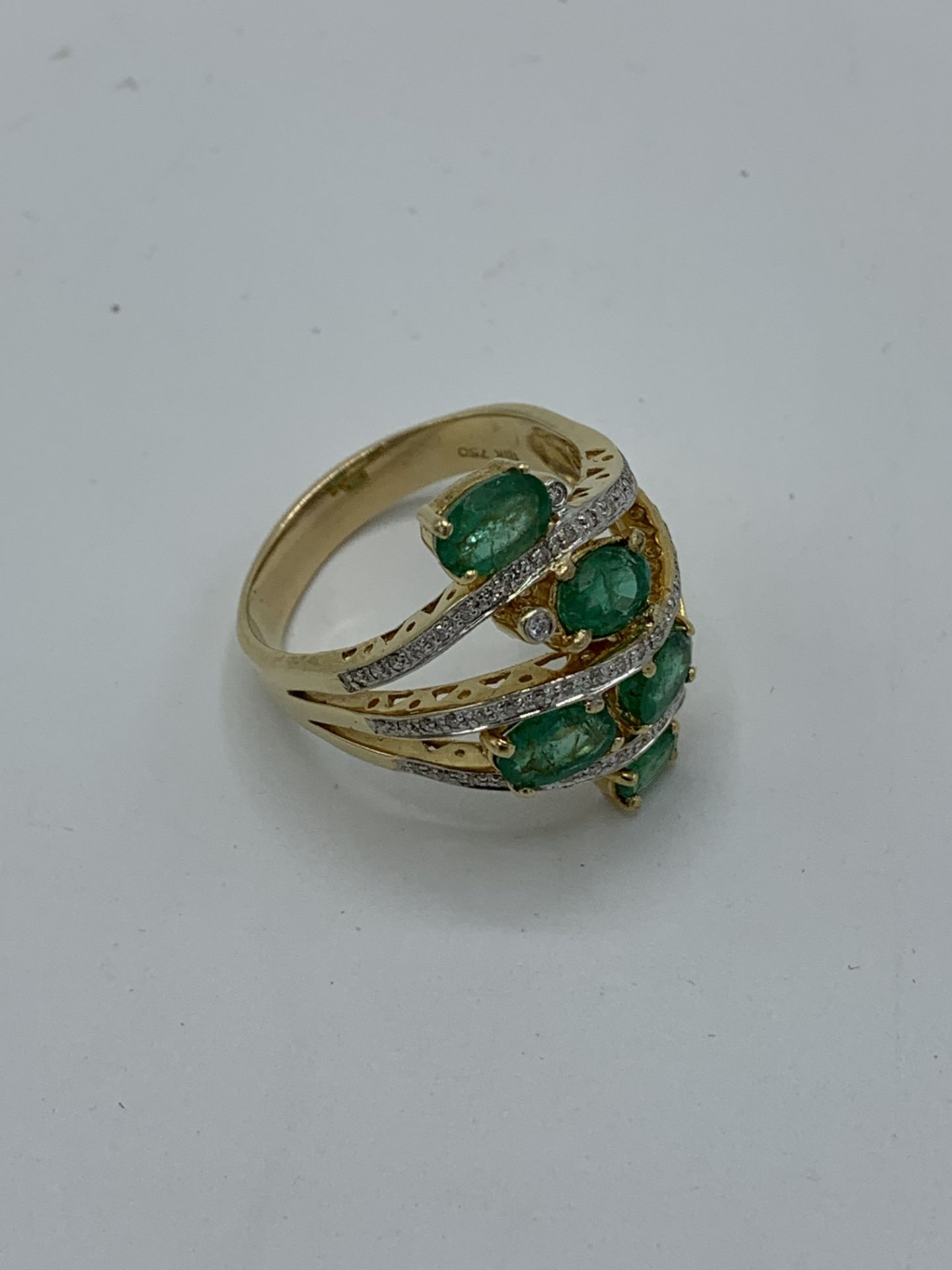 18ct gold 5 emerald and diamond ring, weight 12.3gms, size Y. Estimate £1000-1200.