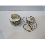 6 x 925 silver bangles. Estimate £20-30.