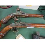 Pair of reproduction flint lock pistols. Estimate £30-40.