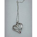 9ct white gold diamond set floating heart necklace. Estimate £30-40.