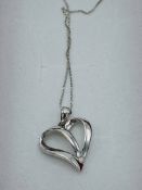 9ct white gold diamond set floating heart necklace. Estimate £30-40.