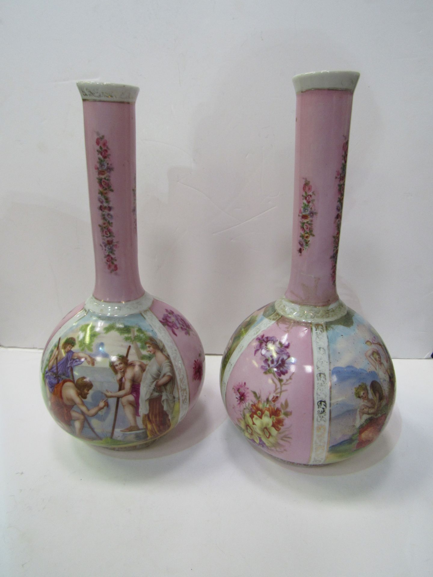 A pair of Limoges style decorative vases, height 34cms. Estimate £30-40.