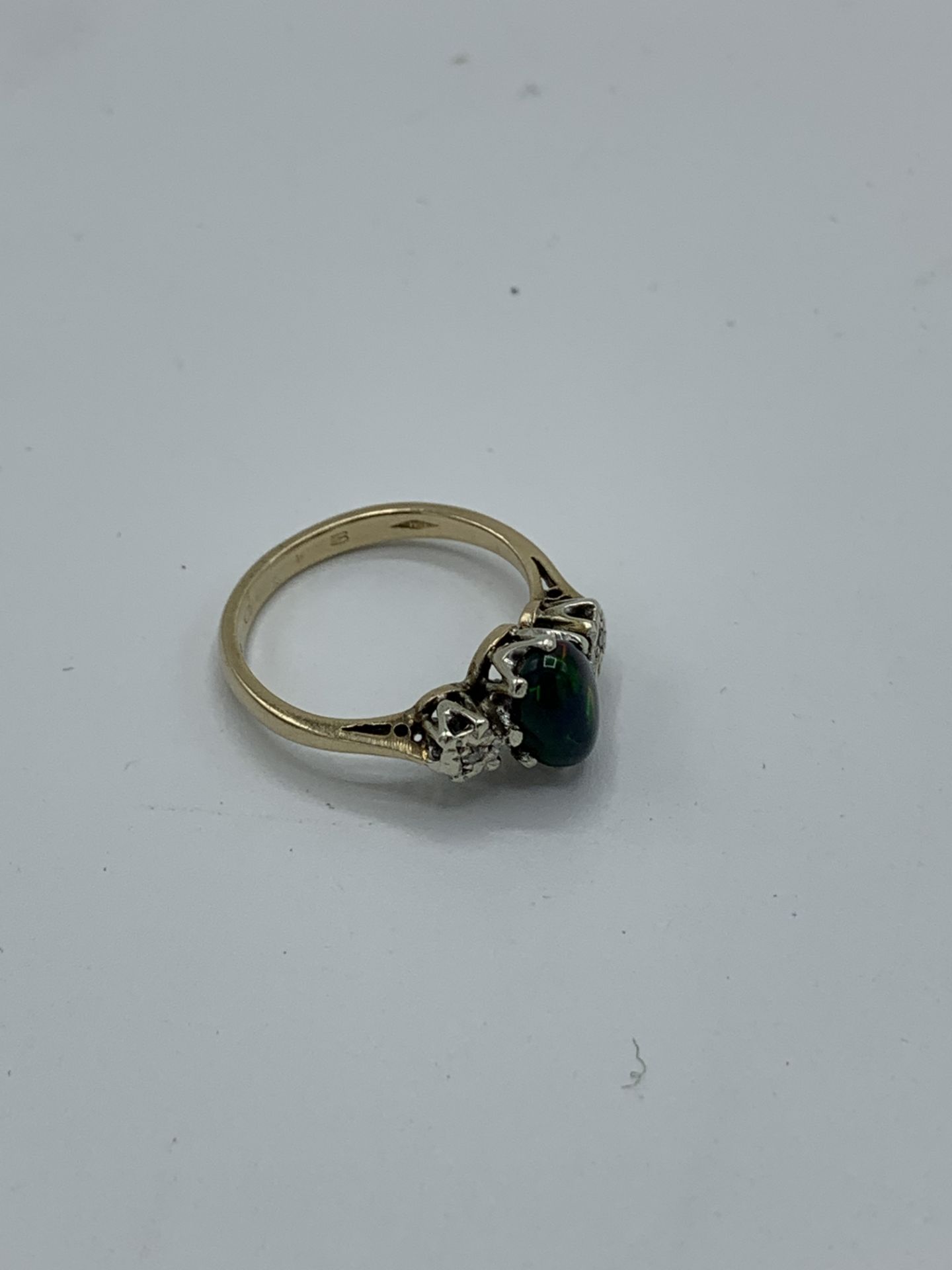 9ct gold ring with centre black opal and diamond either side, weight 2.5gms, size L 1/2. Estimate £ - Image 2 of 2