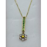 9ct yellow gold green tsavorite, yellow sapphire and white stone pendant necklace. Estimate £30-40.