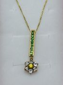 9ct yellow gold green tsavorite, yellow sapphire and white stone pendant necklace. Estimate £30-40.