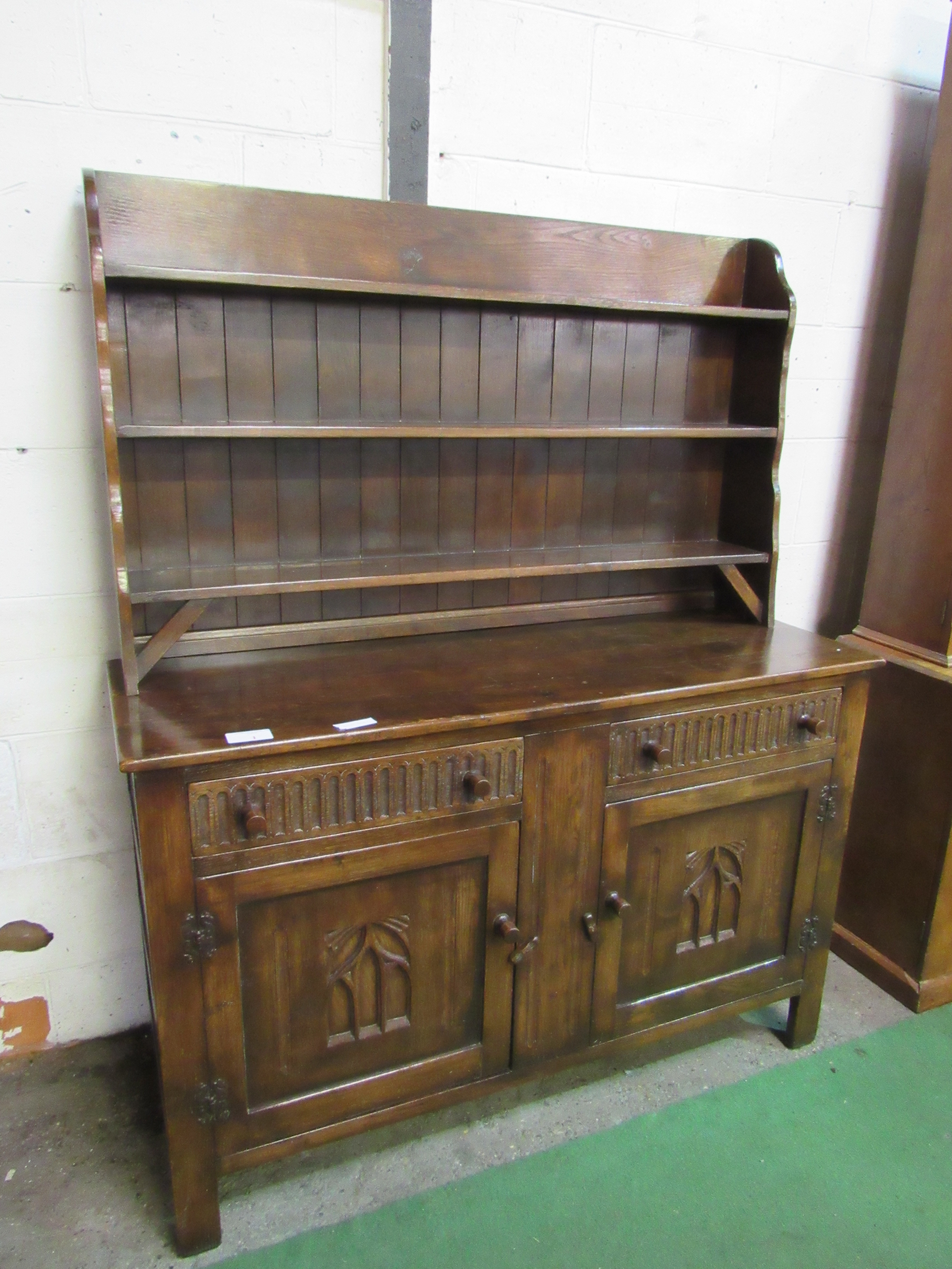 Oak dresser 2 drawers above 2 cupboards, 141 x 49 x 172cms. Estimate £30-40.