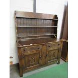 Oak dresser 2 drawers above 2 cupboards, 141 x 49 x 172cms. Estimate £30-40.