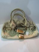 Authentic 'Chloe' cream leather handbag, code no. 03.06.56.4357 with padlock & key. Estimate £60-