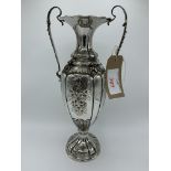 Italian 800 silver profusely decorated two handled vase, weight 23 ozt, height 40cms. Estimate £