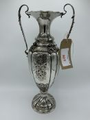 Italian 800 silver profusely decorated two handled vase, weight 23 ozt, height 40cms. Estimate £