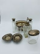 Set of 4 silver topped glass dressing table bottles and a silver topped cut glass toilet water