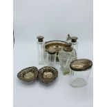 Set of 4 silver topped glass dressing table bottles and a silver topped cut glass toilet water