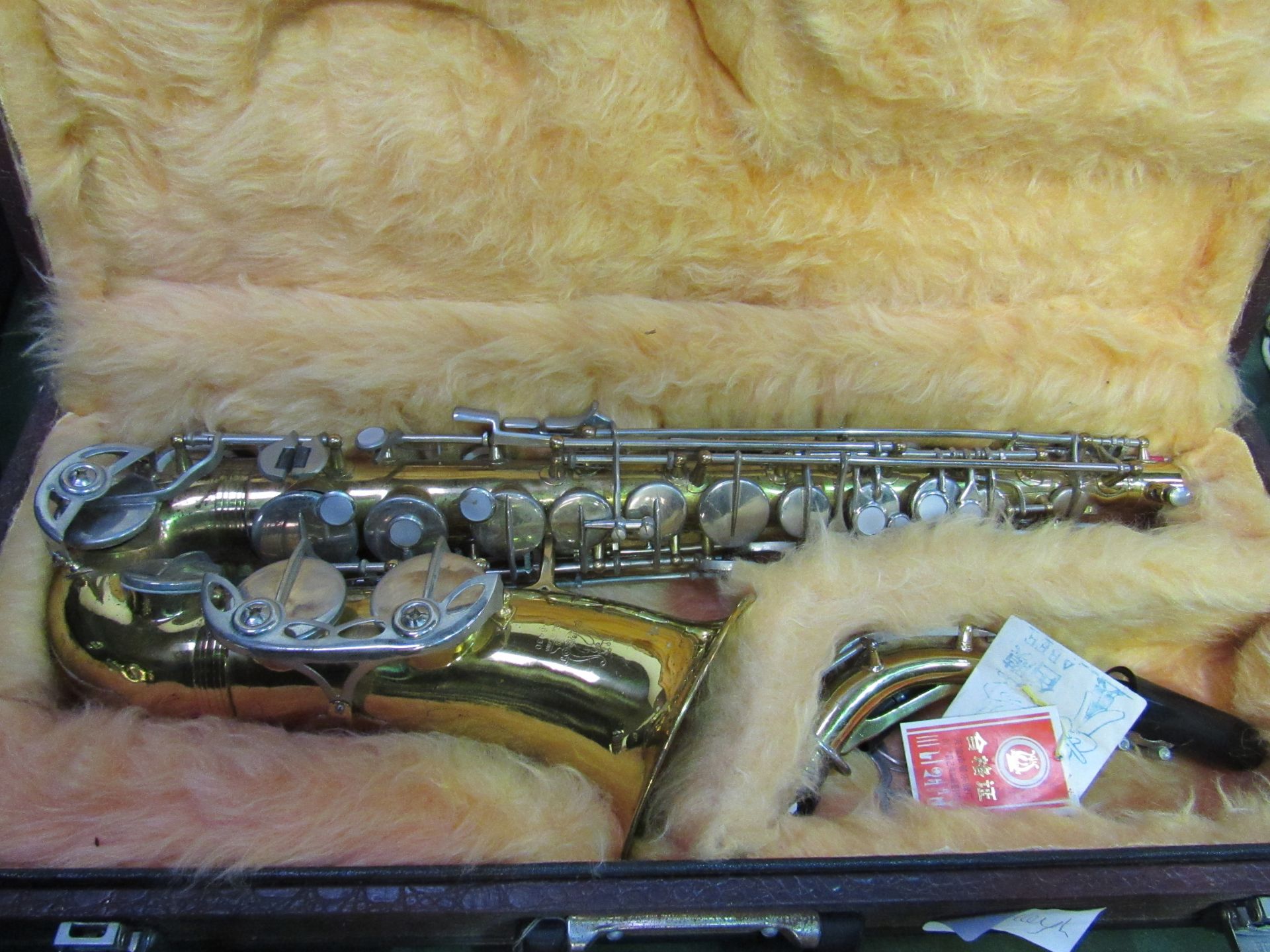 Parrot Alto saxophone with case. Estimate £40-60.