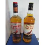 1 litre bottle Famous Grouse red label whisky and 1 litre bottle Famous Grouse black label whisky.