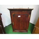 18th Century oak corner wall mounted cupboard, shaped shelves, brass hinges and escutcheons.