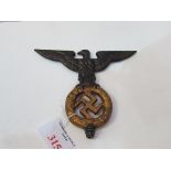 Cast metal Nazi staff top piece, a Spread-Eagle over Swastika. Estimate £40-60.