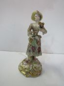 19th Century Meissen figure of a Flower seller with lace trim. Estimate £40-60.