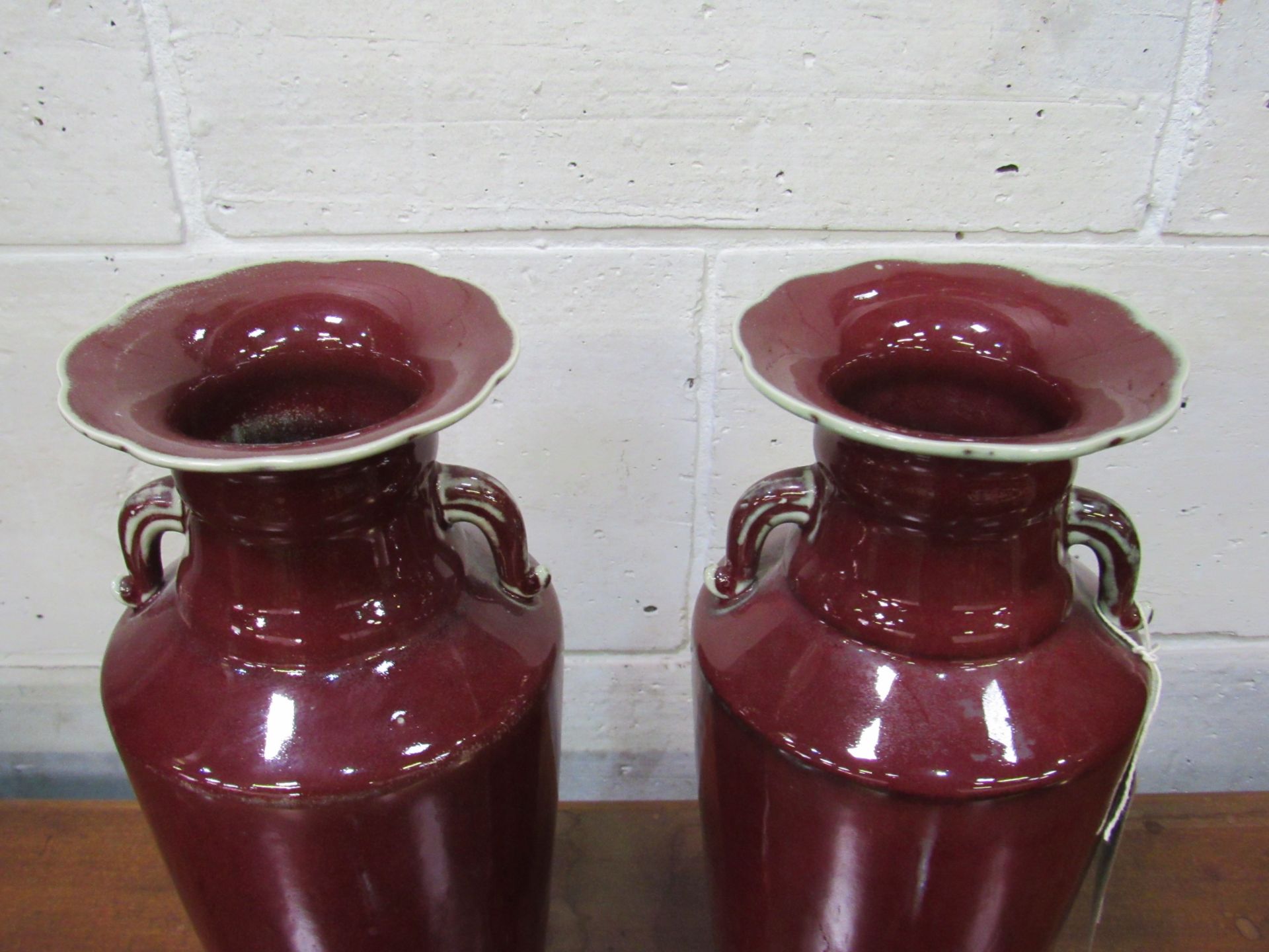 A pair of Sang de Boeuf vases. Height 35cms. Estimate £50-80. - Image 2 of 3