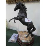 Royal Doulton Cancara Lloyds Bank Black horse with stand. Estimate £120-150.