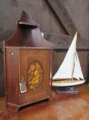 Reproduction model yacht, height 62cms. Mahogany wall cupboard with inlaid oval front. Estimate £