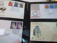 Box of First Day Covers in 3 albums and loose stamps 1960-2006. Estimate £35-45.