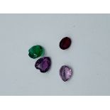 4 x coloured glass ""stones"". Estimate £10-20.